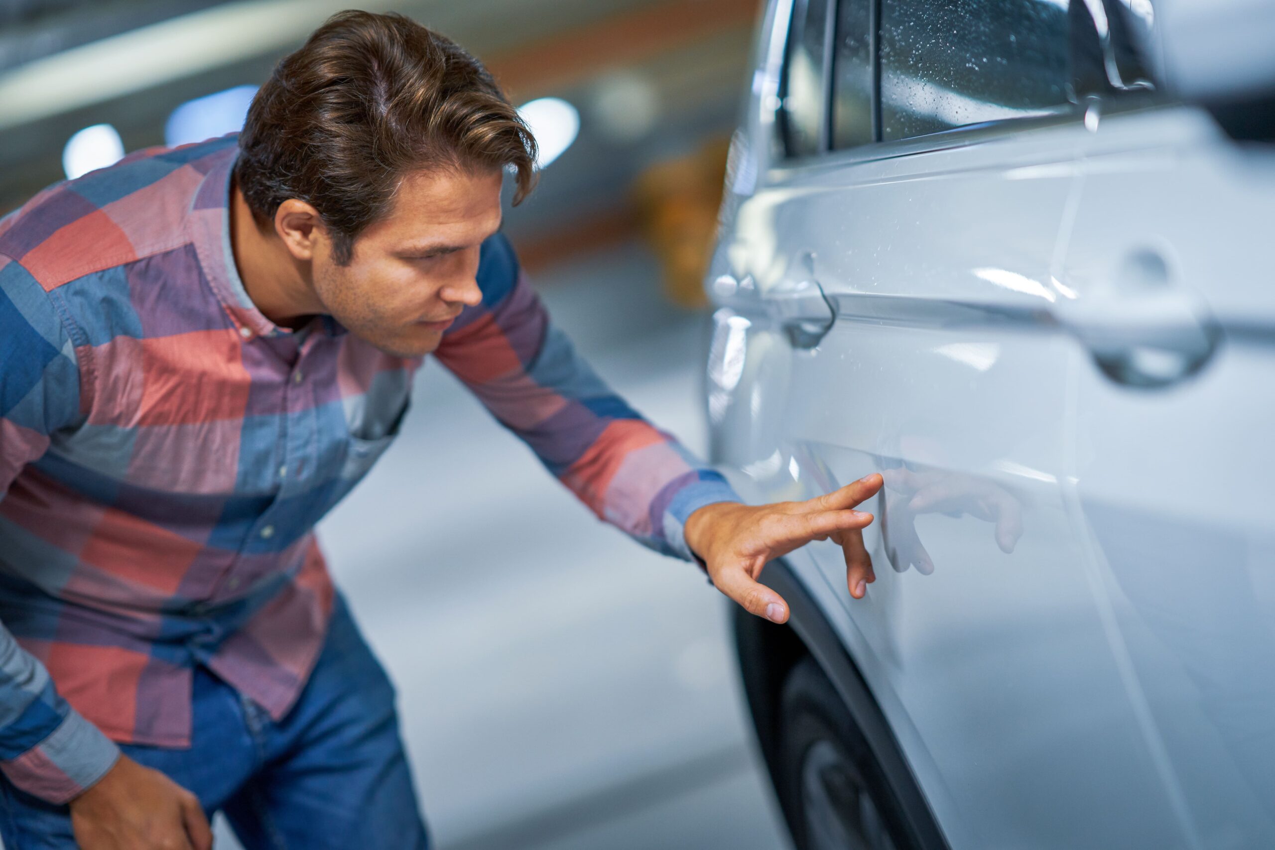 portrait of adult man with scratched car at underg 2022 05 13 02 31 44 utc min